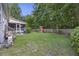 Expansive backyard featuring a playset, screened porch, and lush greenery at 1901 Bairds Cv, Charleston, SC 29414