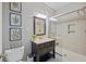 Updated bathroom featuring a glass-enclosed shower, vanity, and modern fixtures at 1901 Bairds Cv, Charleston, SC 29414