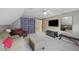 Cozy bonus room featuring neutral carpet, furnishings, and a ceiling fan at 1901 Bairds Cv, Charleston, SC 29414