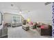Bright bonus room with neutral carpet and furniture, fitness equipment, and a ceiling fan at 1901 Bairds Cv, Charleston, SC 29414
