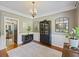 Formal dining room with chandelier, dark cabinet, and large mirrors at 1901 Bairds Cv, Charleston, SC 29414