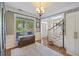 Bright and inviting foyer with hardwood floors, a decorative rug, and a view of the staircase at 1901 Bairds Cv, Charleston, SC 29414