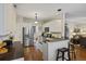 A kitchen featuring white cabinetry, stainless steel appliances, and an eat-in bar area at 1901 Bairds Cv, Charleston, SC 29414