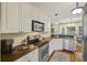 Updated kitchen with stainless steel appliances, granite countertops, and hardwood floors at 1901 Bairds Cv, Charleston, SC 29414