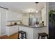 Kitchen featuring stainless steel appliances, white cabinetry, and bar seating at 1901 Bairds Cv, Charleston, SC 29414
