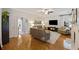 Bright living room with hardwood floors, a fireplace, and modern furnishings creating a welcoming atmosphere at 1901 Bairds Cv, Charleston, SC 29414
