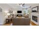 Bright living room featuring a fireplace, plush seating, and an open layout at 1901 Bairds Cv, Charleston, SC 29414