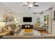 Inviting living room featuring hardwood floors, a fireplace, and comfortable seating arrangements for relaxation at 1901 Bairds Cv, Charleston, SC 29414