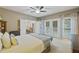 Spacious main bedroom with large windows offering abundant natural light and outside access at 1901 Bairds Cv, Charleston, SC 29414