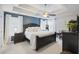 Serene main bedroom with tray ceiling, dark furniture, and ample natural light at 1901 Bairds Cv, Charleston, SC 29414