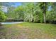Private backyard with a pool and greenery. The perfect place for relaxation and outdoor activities at 197 High Grove Rd, Summerville, SC 29485
