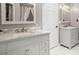 Bright bathroom with double sink vanity featuring marble countertops and modern fixtures at 197 High Grove Rd, Summerville, SC 29485