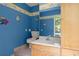 Bathroom with bright blue walls, wall decorations and vanity sink at 197 High Grove Rd, Summerville, SC 29485