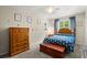 bedroom with a playful design, featuring a wooden bed, chest, and cheerful decorations at 197 High Grove Rd, Summerville, SC 29485