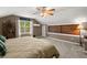 Cozy bedroom featuring a sloped ceiling, a ceiling fan, and natural light from the window at 197 High Grove Rd, Summerville, SC 29485