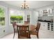 Cozy dining room featuring a wooden table, neutral paint, and natural light at 197 High Grove Rd, Summerville, SC 29485