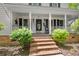 Inviting front porch with brick steps and classic details, perfect for relaxing and enjoying the outdoors at 197 High Grove Rd, Summerville, SC 29485