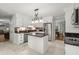 Modern kitchen featuring white cabinets, stainless steel appliances, granite countertops, and an island at 197 High Grove Rd, Summerville, SC 29485