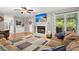 Cozy living room featuring a fireplace, large TV, comfortable seating, and stylish decor at 197 High Grove Rd, Summerville, SC 29485