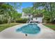 Backyard with a private pool, white exterior, and mature trees at 197 High Grove Rd, Summerville, SC 29485