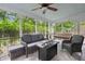 Relaxing screened porch complete with furniture and a fire pit, perfect for outdoor living at 197 High Grove Rd, Summerville, SC 29485