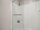 Modern shower with glass door, built in seat, and shampoo storage at 197 High Grove Rd, Summerville, SC 29485