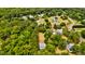 Aerial view of homes nestled among trees in a neighborhood, showcasing a peaceful and private residential area at 1976 Liberia Rd, Wadmalaw Island, SC 29487