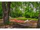 Relaxing hammock hanging between trees in a private backyard setting at 1976 Liberia Rd, Wadmalaw Island, SC 29487
