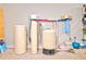 Basement utility area with water filtration system, pump, and water tanks at 1976 Liberia Rd, Wadmalaw Island, SC 29487
