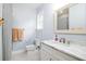 Bathroom with white vanity, marble countertop, and updated fixtures at 1976 Liberia Rd, Wadmalaw Island, SC 29487