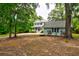 Charming two-story home with a spacious front yard and detached garage at 1976 Liberia Rd, Wadmalaw Island, SC 29487