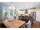 Bright kitchen with hardwood floors, granite countertops, stainless steel appliances, and pendant lighting at 1976 Liberia Rd, Wadmalaw Island, SC 29487