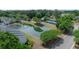 An aerial view of the community pond, a tennis court, and beautifully landscaped grounds at 2011 N Highway 17 # 2300F, Mount Pleasant, SC 29466