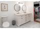 Bathroom with double vanity, dual mirrors, and modern toilet next to walk in closet at 2011 N Highway 17 # 2300F, Mount Pleasant, SC 29466