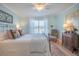 Charming bedroom with a wrought iron bed, side tables, and bright, natural light at 2011 N Highway 17 # 2300F, Mount Pleasant, SC 29466