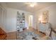 Bright bedroom featuring a decorative bookcase and an antique dresser at 2011 N Highway 17 # 2300F, Mount Pleasant, SC 29466