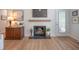 Living room fireplace with wooden mantel, decorative items, and plant accents at 2011 N Highway 17 # 2300F, Mount Pleasant, SC 29466