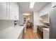 Bright kitchen with stainless steel appliances, white cabinets, and open dining area at 2011 N Highway 17 # 2300F, Mount Pleasant, SC 29466