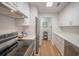 Modern kitchen features stainless steel appliances, white cabinets, and light countertops at 2011 N Highway 17 # 2300F, Mount Pleasant, SC 29466