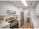Modern kitchen with stainless steel appliances, white cabinets, and ample counter space at 2011 N Highway 17 # 2300F, Mount Pleasant, SC 29466