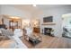 Open-concept living room with a fireplace, dining area, and modern decor at 2011 N Highway 17 # 2300F, Mount Pleasant, SC 29466