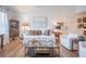Comfortable living room with white sofa, light wood floors, and ample seating at 2011 N Highway 17 # 2300F, Mount Pleasant, SC 29466