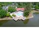 Aerial view of the neighborhood swimming pool, surrounded by lush landscaping and a serene pond at 2011 N Highway 17 # 2300F, Mount Pleasant, SC 29466