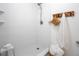 Shower with white subway tile, seat, and basket for towels at 2011 N Highway 17 # 2300F, Mount Pleasant, SC 29466