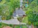 An aerial view of a charming home with lush landscaping, a well-manicured lawn, and a long driveway at 2076 Rookery Ln, Charleston, SC 29414