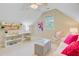 Finished attic with a window, a desk, and sitting area at 2076 Rookery Ln, Charleston, SC 29414