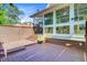 Charming back patio with wood floors, potted plants, and a screened in porch attached to the home at 2076 Rookery Ln, Charleston, SC 29414