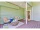 Cozy back porch with comfortable seating, a stylish rug, and easy access to the indoors through sliding glass doors at 2076 Rookery Ln, Charleston, SC 29414
