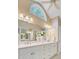 Bathroom featuring double vanity, large mirror, and plenty of lighting at 2076 Rookery Ln, Charleston, SC 29414