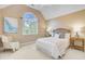 Well-lit bedroom features a large arched window and neutral color scheme at 2076 Rookery Ln, Charleston, SC 29414
